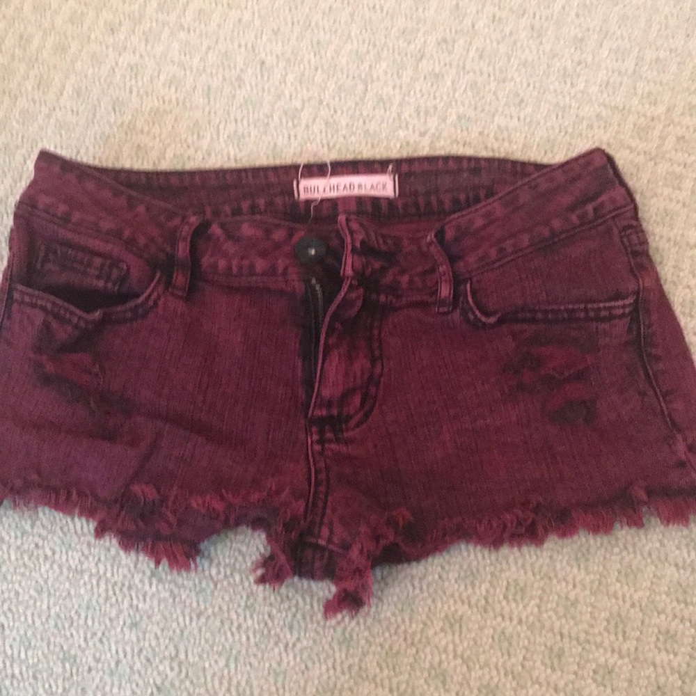 red acid washed jean shorts